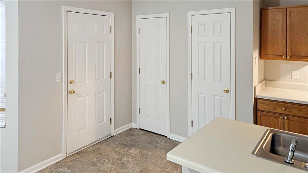 5737 Strathmoor Manor Circle Lithonia, GA 30058 - Photo 5 of 14 a room with a bed and a view of bedroom