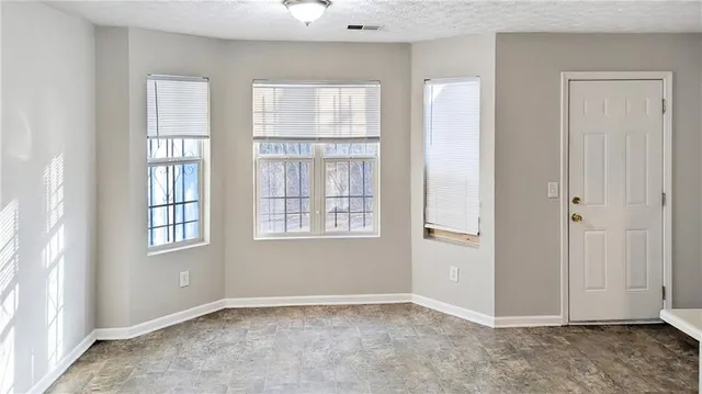 an empty room with windows