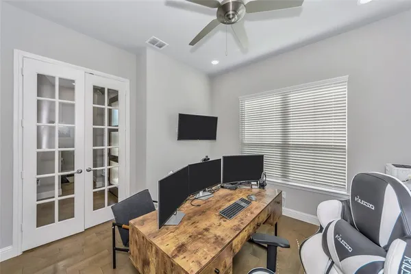 a bathroom with a sink vanity mirror and toilet