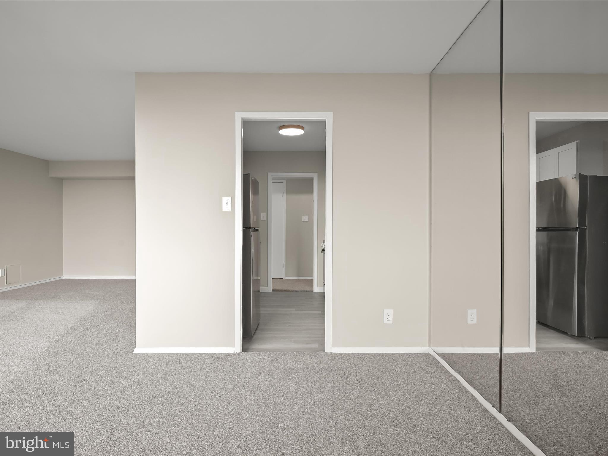 9701 Fields Road, Unit 1607 Gaithersburg, MD 20878 - Photo 38 of 42 an empty room with closet and a bathroom