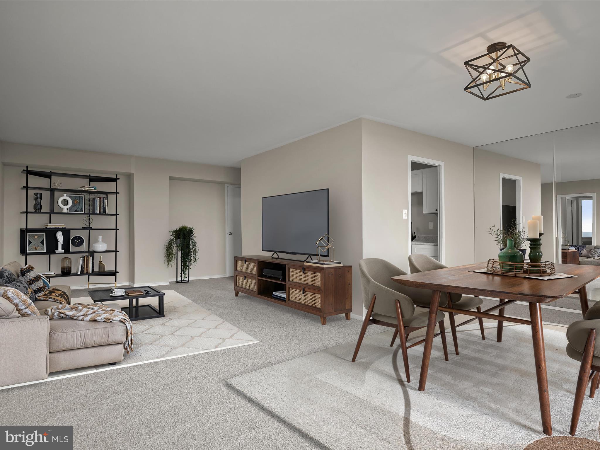 9701 Fields Road, Unit 1607 Gaithersburg, MD 20878 - Photo 35 of 42 a living room with furniture and a flat screen tv