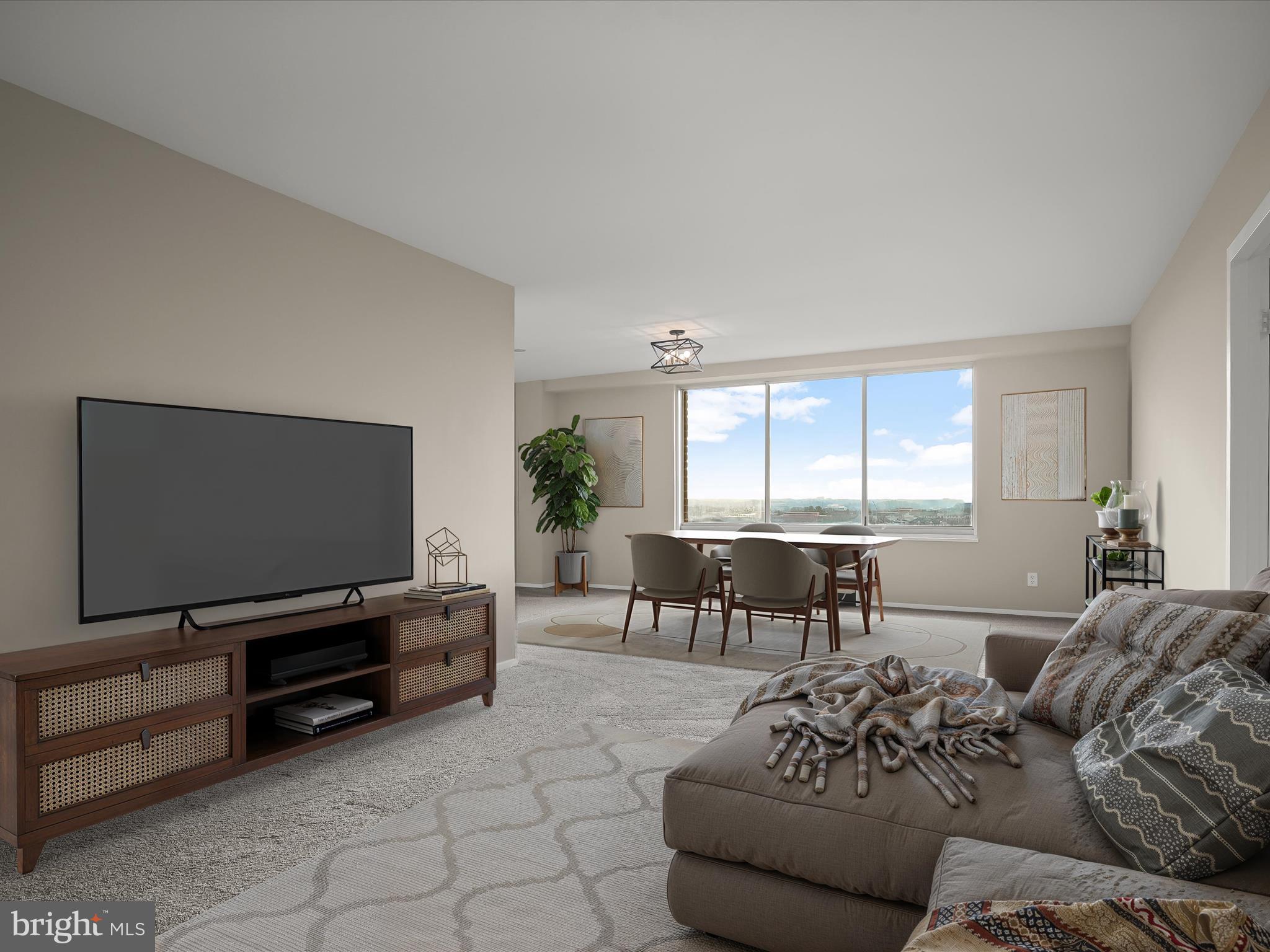 9701 Fields Road, Unit 1607 Gaithersburg, MD 20878 - Photo 40 of 42 a living room with furniture and a flat screen tv