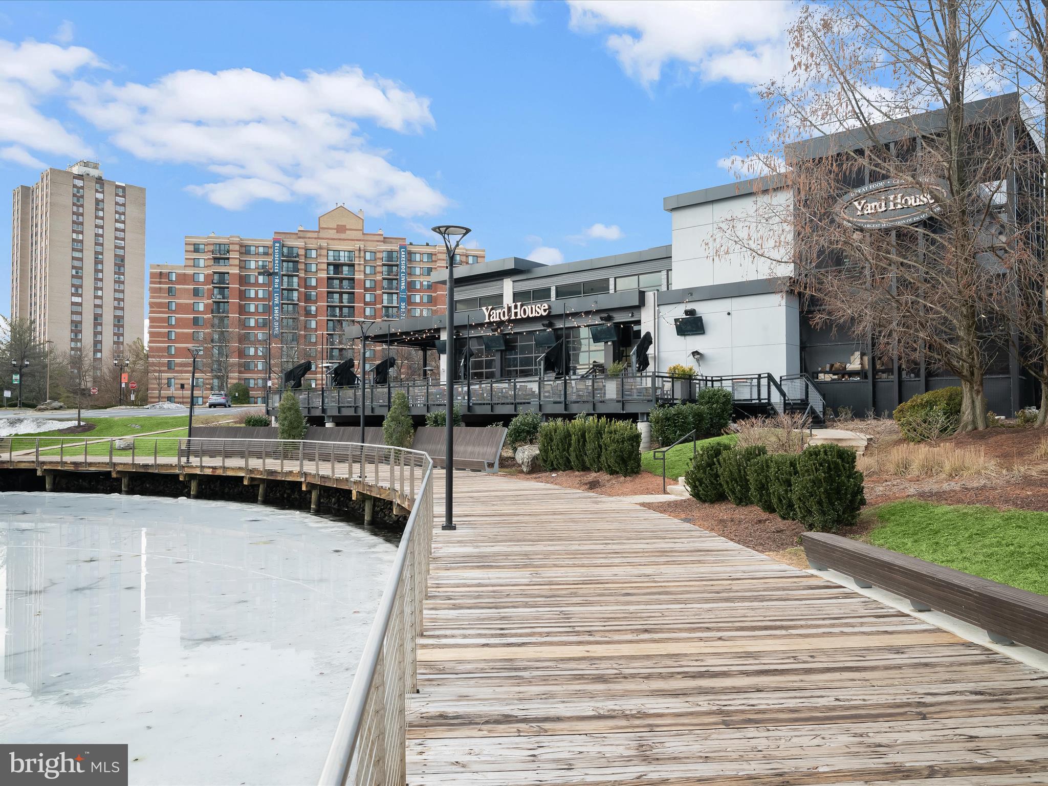 9701 Fields Road, Unit 1607 Gaithersburg, MD 20878 - Photo 31 of 42 a swimming pool with outdoor seating and yard