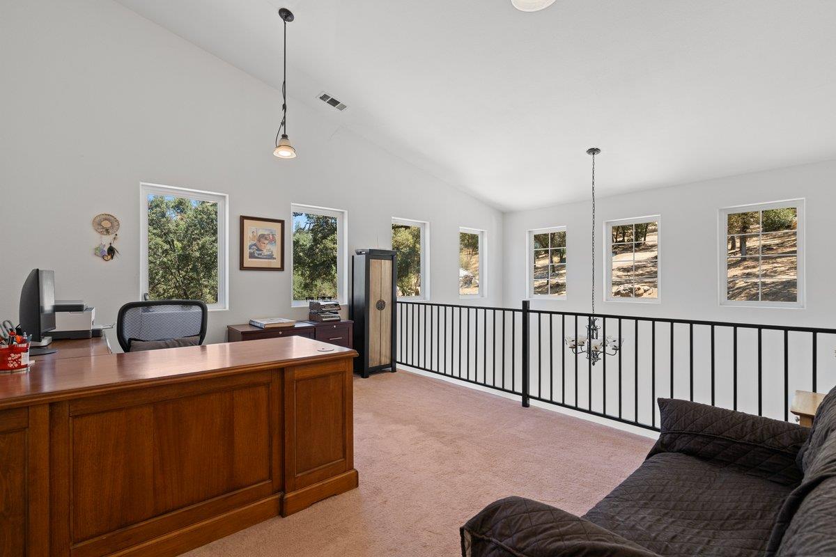 23392 Meyer Ravine Road Grass Valley, CA 95949 - Photo 28 of 58 a view of a livingroom with furniture and a window