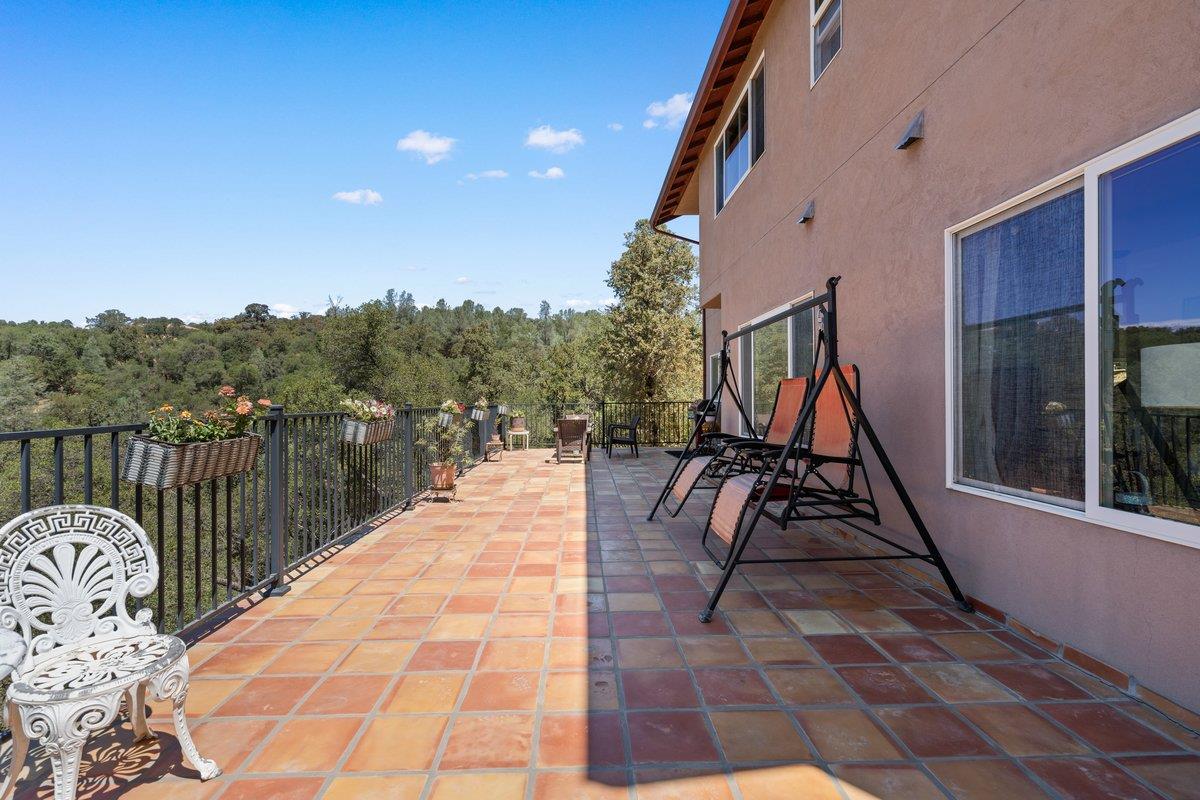 23392 Meyer Ravine Road Grass Valley, CA 95949 - Photo 33 of 58 a view of balcony with furniture
