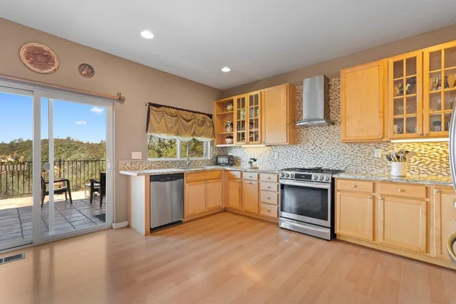 a kitchen with a stove a sink and a refrigerator