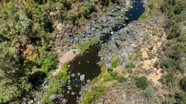 a aerial view of a house with a yard