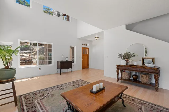 a living room with furniture and a rug