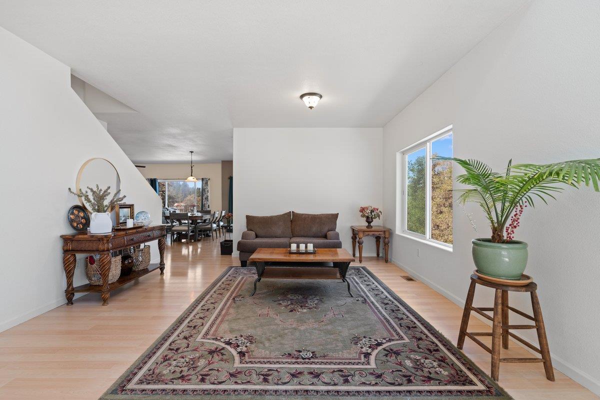 23392 Meyer Ravine Road Grass Valley, CA 95949 - Photo 9 of 58 a living room with furniture and a rug