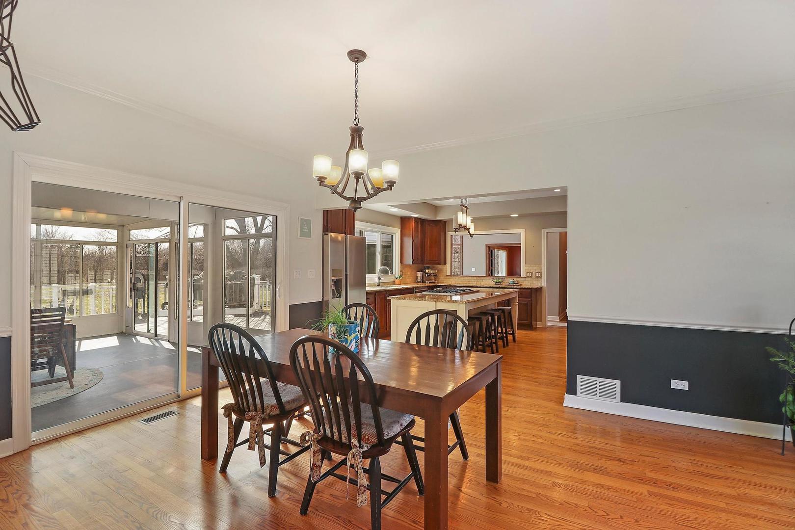 159 Helm Road Barrington Hills, IL 60010 - Photo 18 of 57 a view of a dining room with furniture window and outside view