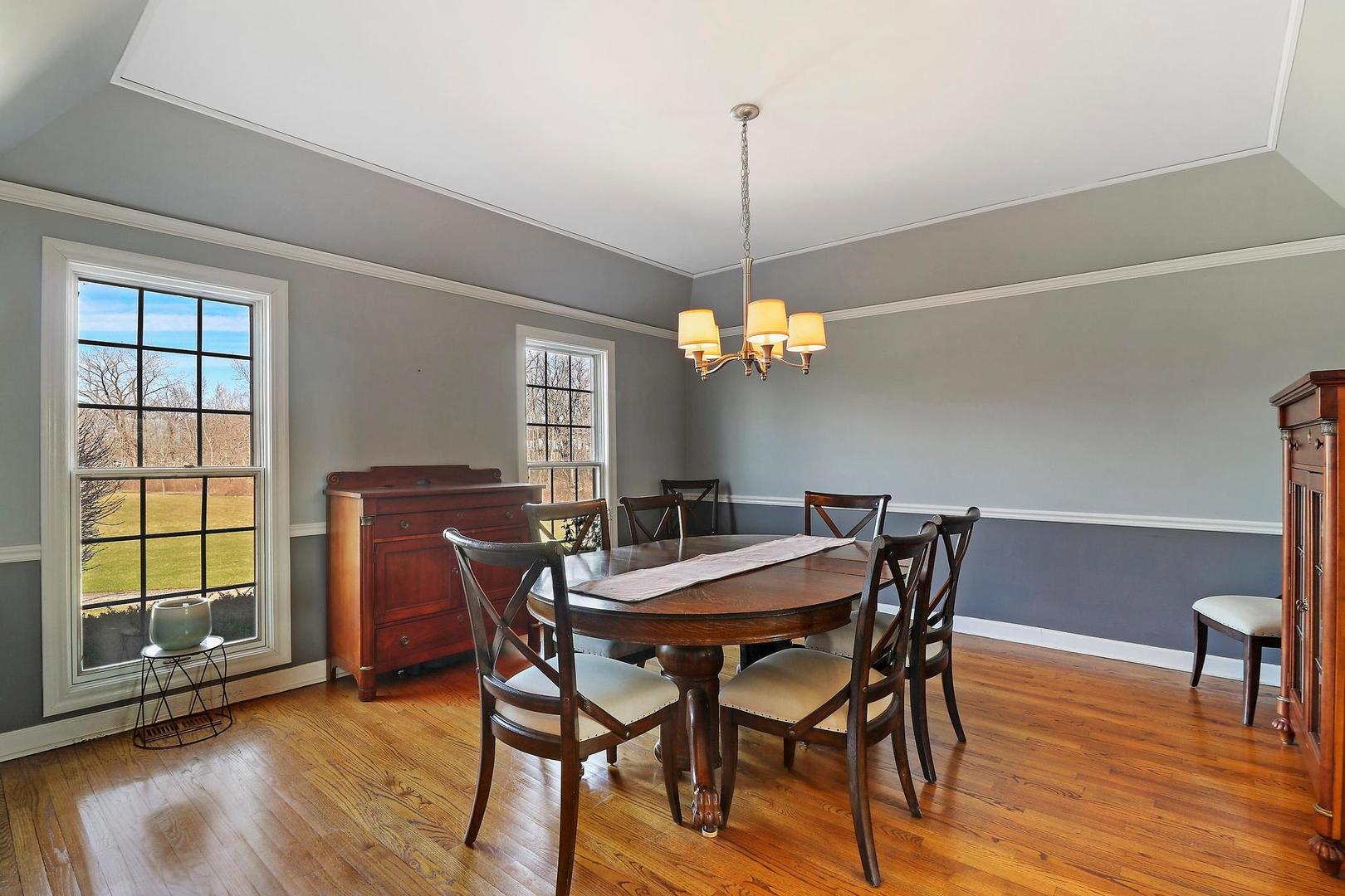 159 Helm Road Barrington Hills, IL 60010 - Photo 19 of 57 a view of a dining room with furniture window and wooden floor