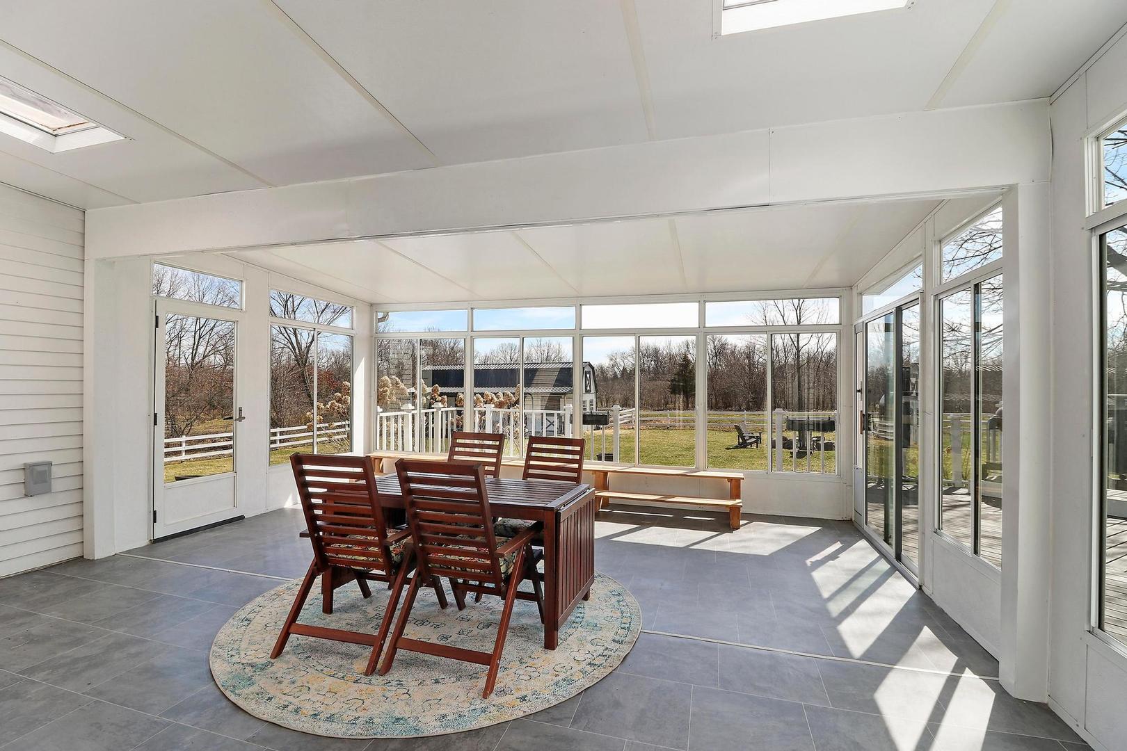 159 Helm Road Barrington Hills, IL 60010 - Photo 21 of 57 a dining room with furniture and floor to ceiling window