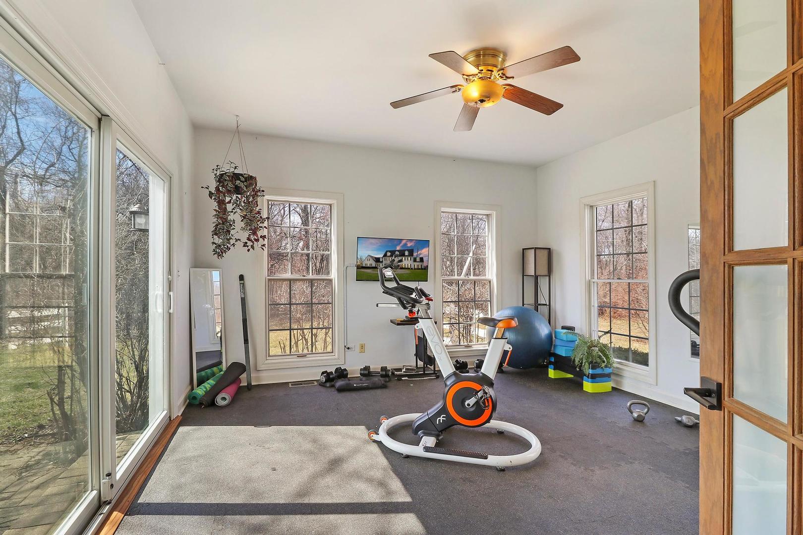 159 Helm Road Barrington Hills, IL 60010 - Photo 23 of 57 a view of a livingroom with furniture and gym equipment