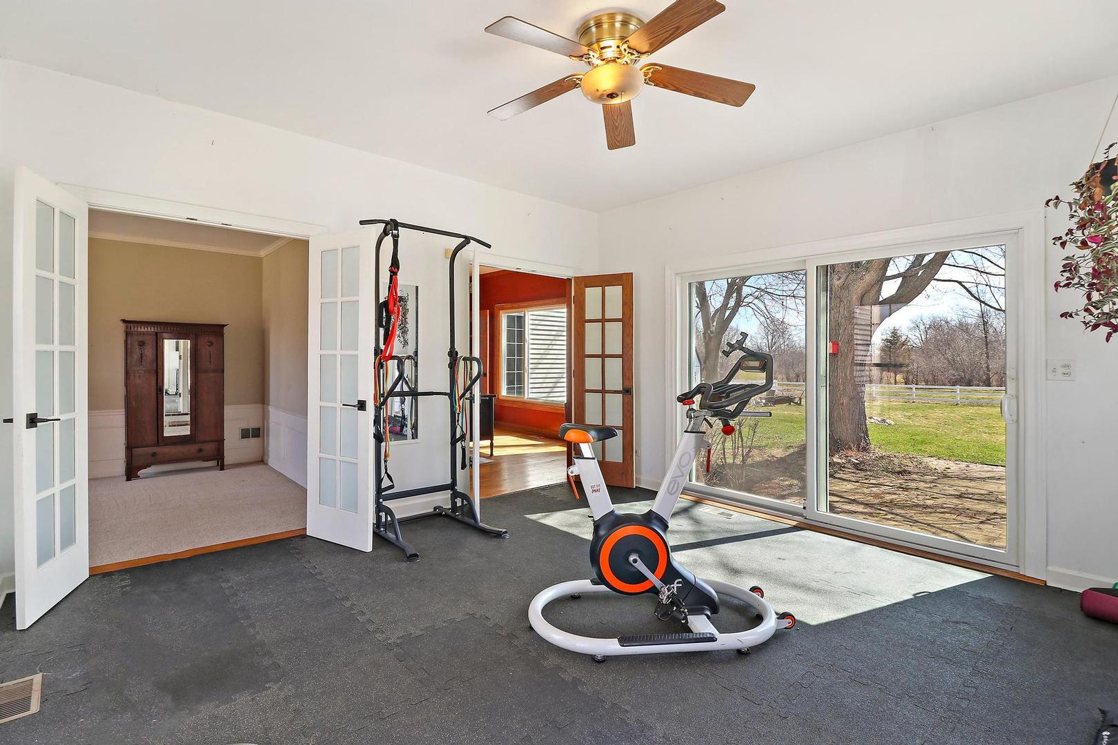 159 Helm Road Barrington Hills, IL 60010 - Photo 24 of 57 a living room with furniture and a floor to ceiling window