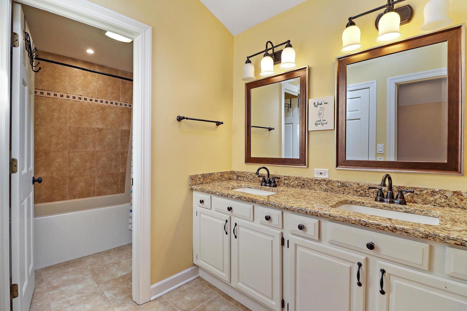 159 Helm Road Barrington Hills, IL 60010 - Photo 38 of 57 a bathroom with a granite countertop sink mirror and a bathtub