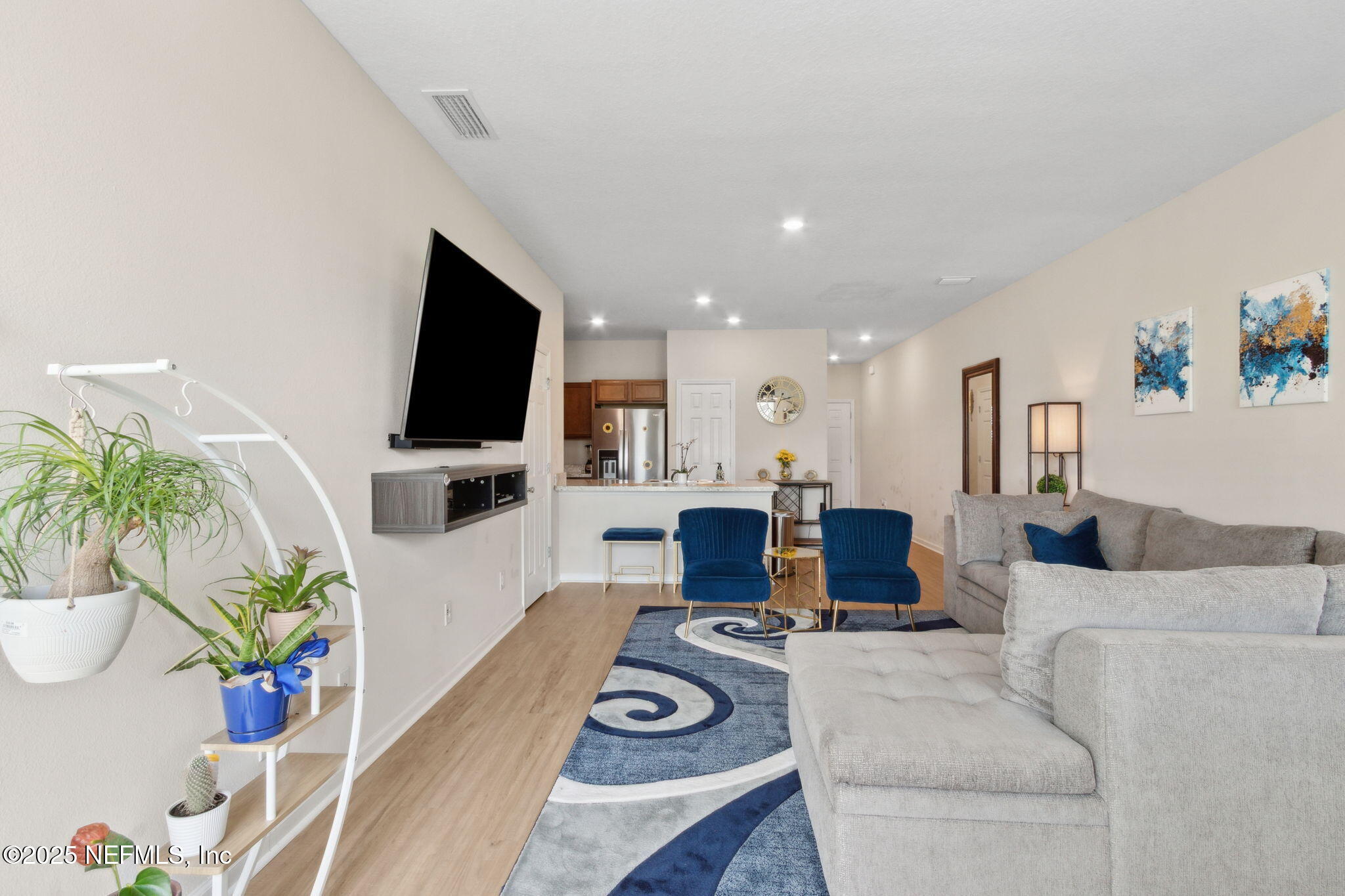7940 Merchants Way Jacksonville, FL 32222 - Photo 13 of 51 a living room with furniture and a flat screen tv