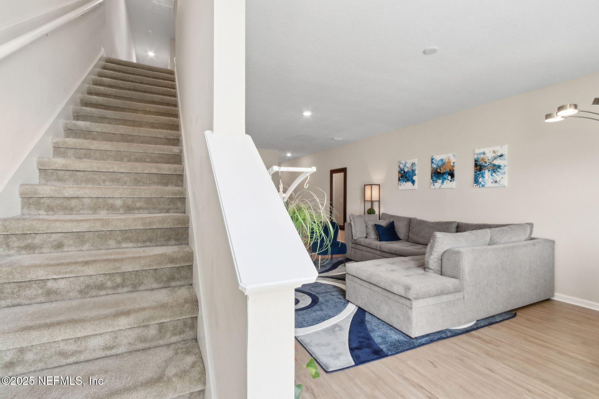7940 Merchants Way Jacksonville, FL 32222 - Photo 14 of 51 a living room with furniture and stairs