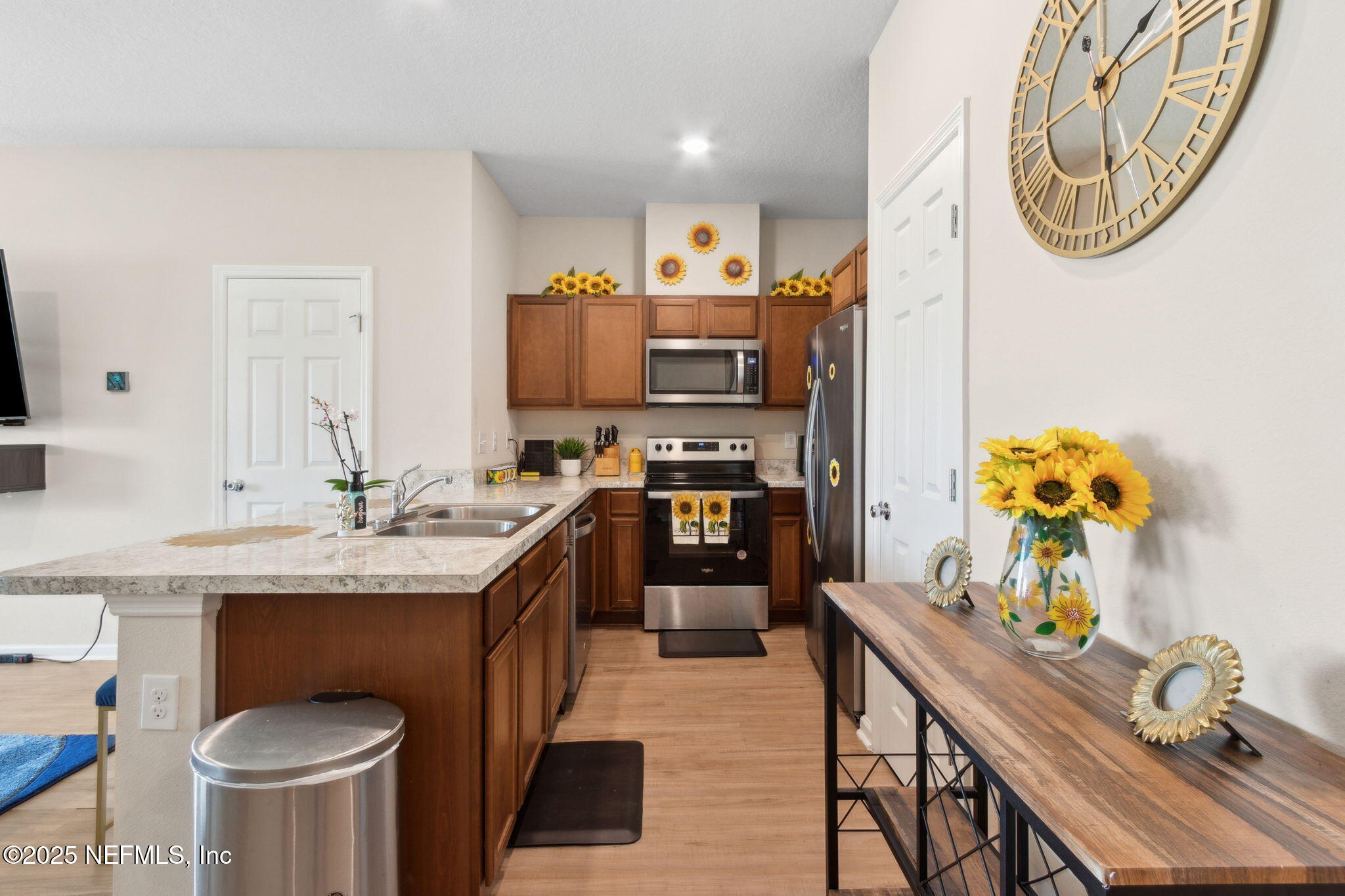 7940 Merchants Way Jacksonville, FL 32222 - Photo 18 of 51 a kitchen with stainless steel appliances granite countertop a sink a stove and a refrigerator