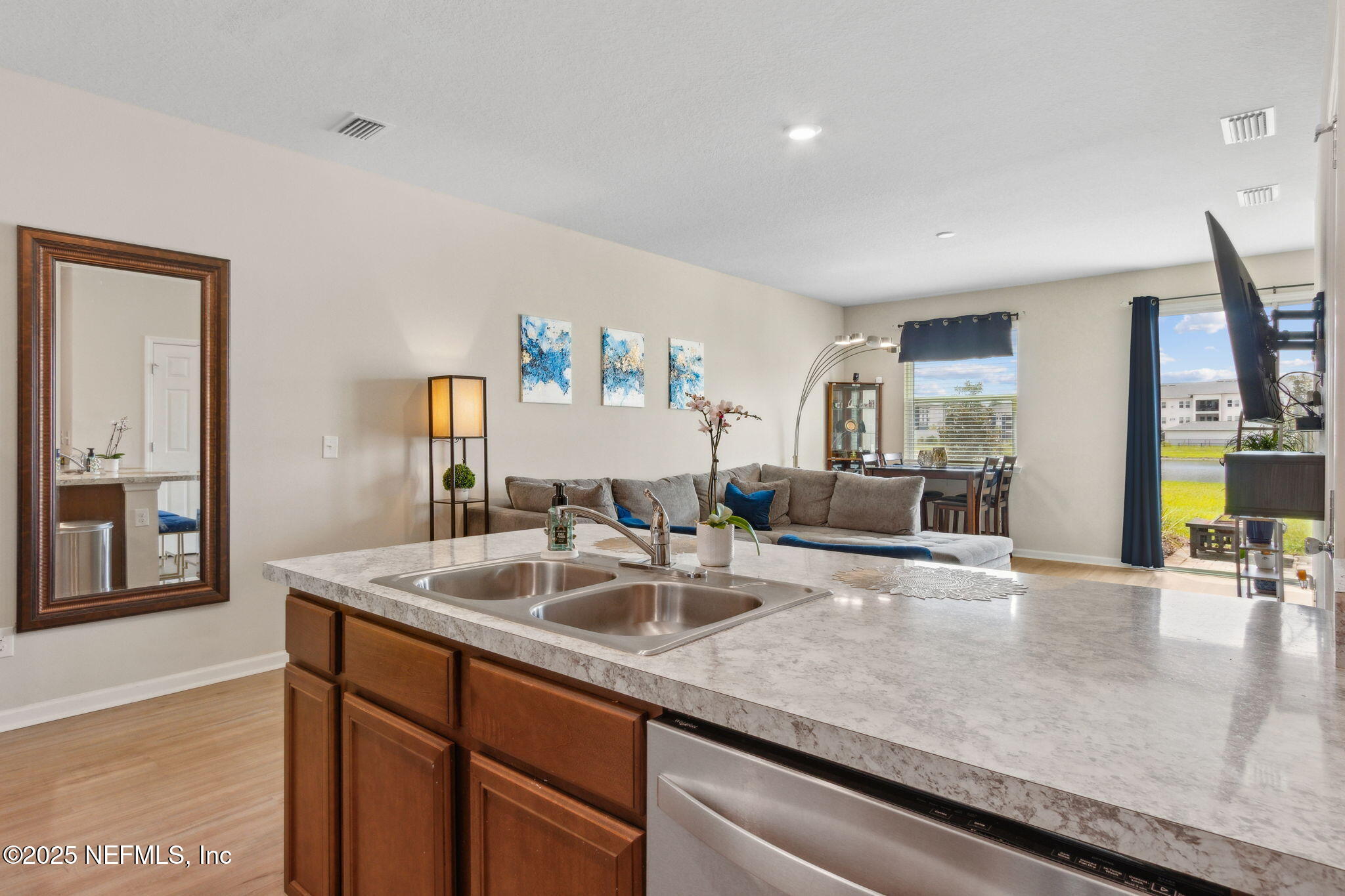 7940 Merchants Way Jacksonville, FL 32222 - Photo 20 of 51 a kitchen with stainless steel appliances granite countertop a sink and a refrigerator