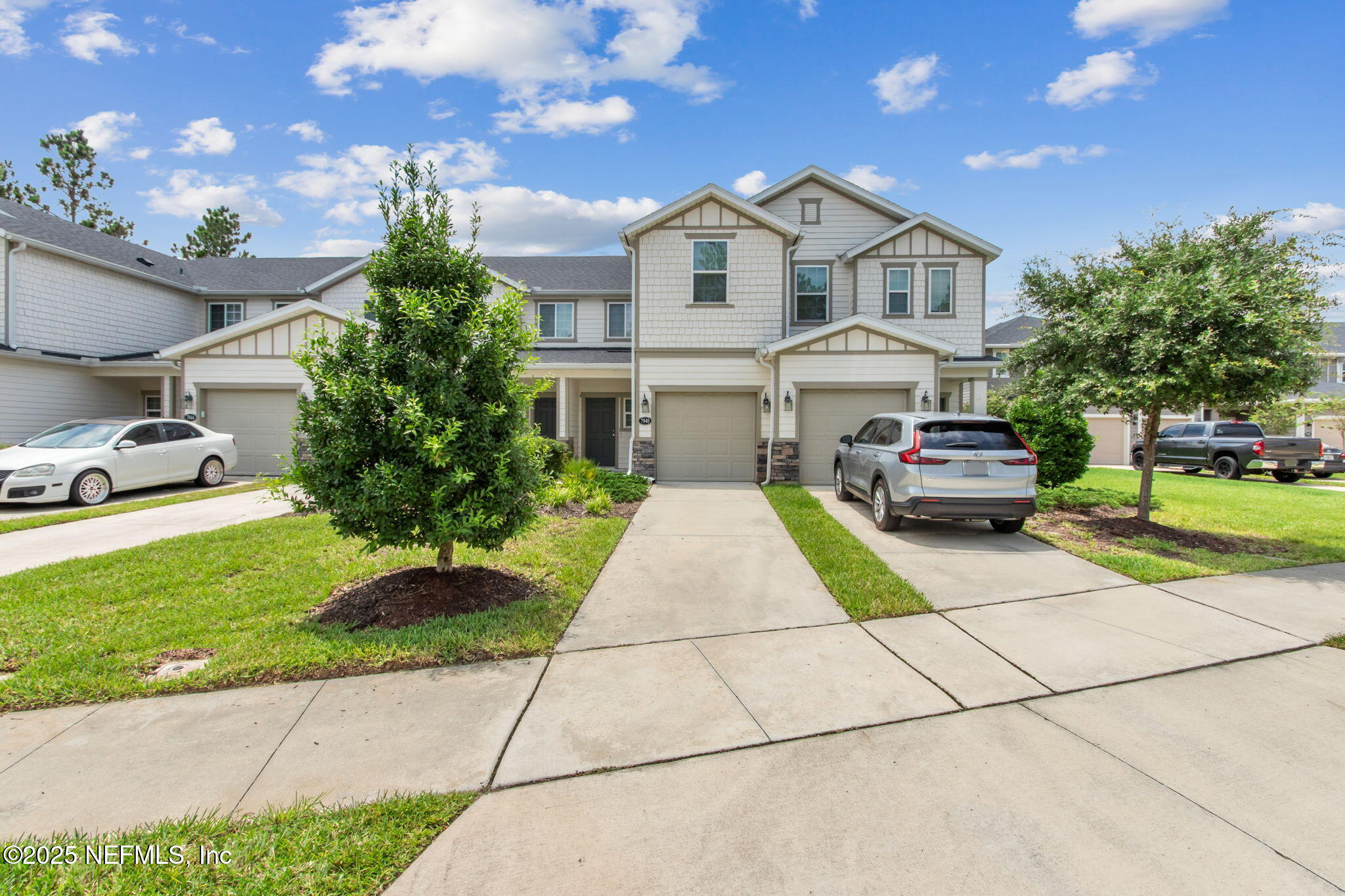 7940 Merchants Way Jacksonville, FL 32222 - Photo 2 of 51 a front view of a house with a garden