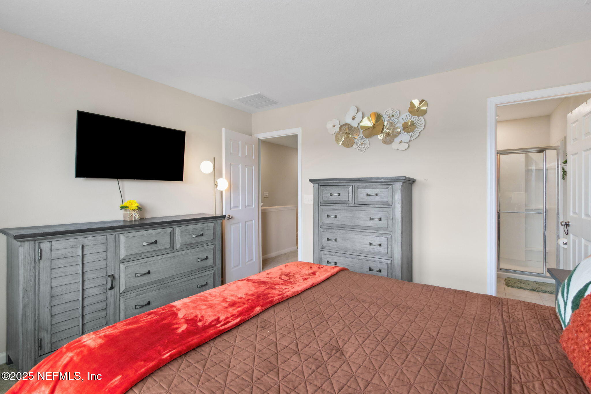 7940 Merchants Way Jacksonville, FL 32222 - Photo 25 of 51 a bedroom with a bed and a flat screen tv