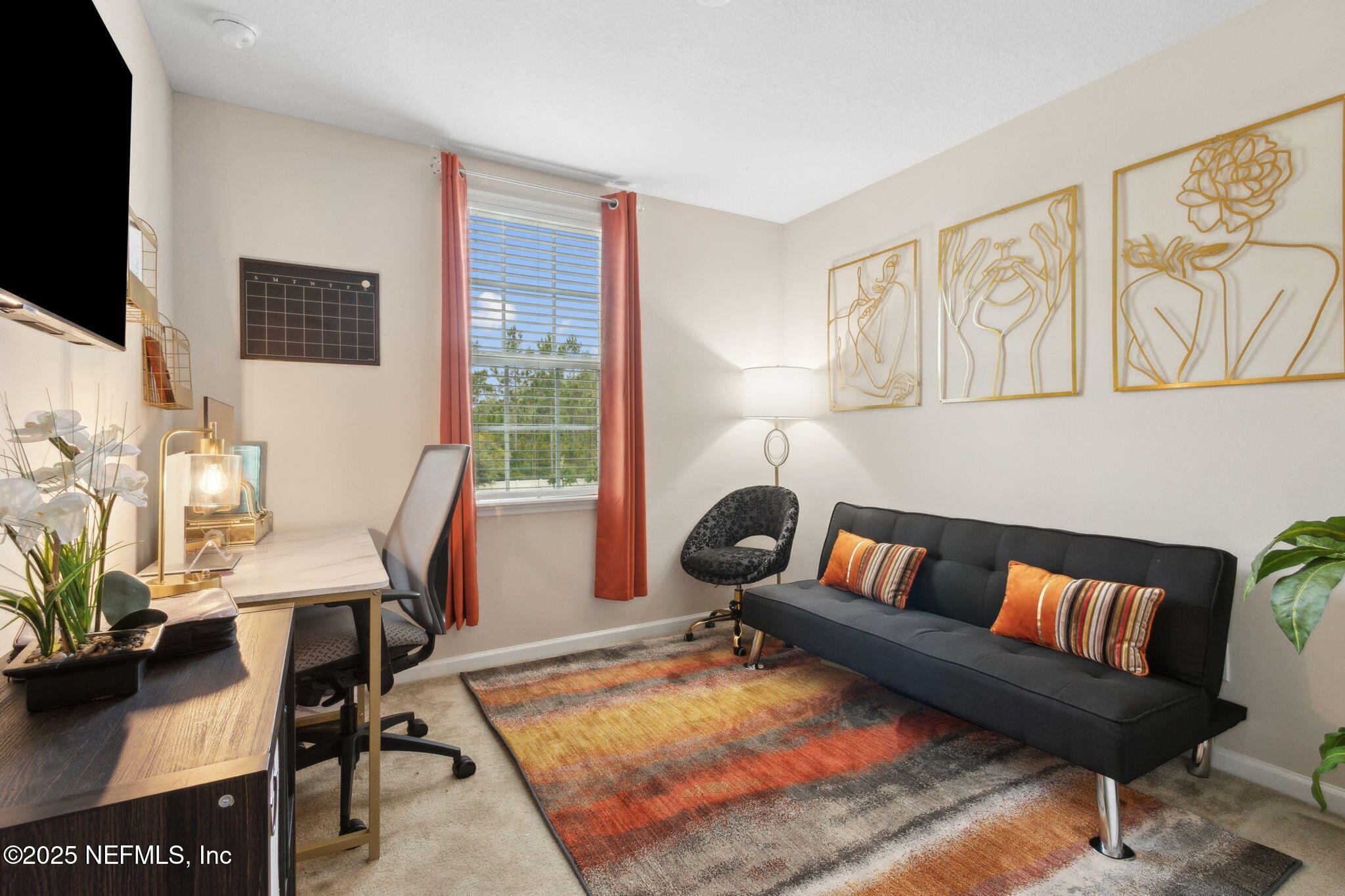 7940 Merchants Way Jacksonville, FL 32222 - Photo 27 of 51 a living room with furniture and a flat screen tv