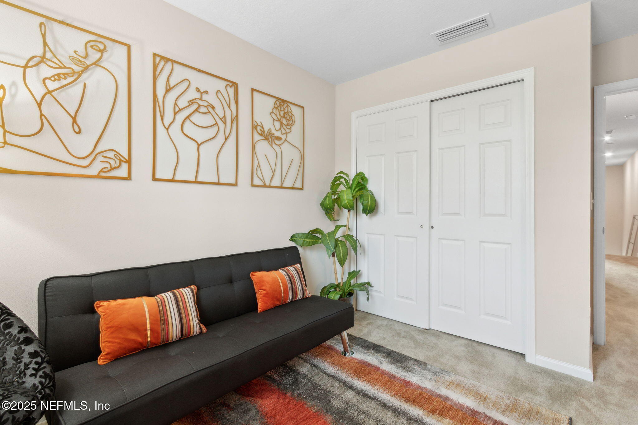 7940 Merchants Way Jacksonville, FL 32222 - Photo 28 of 51 a living room with furniture and a potted plant