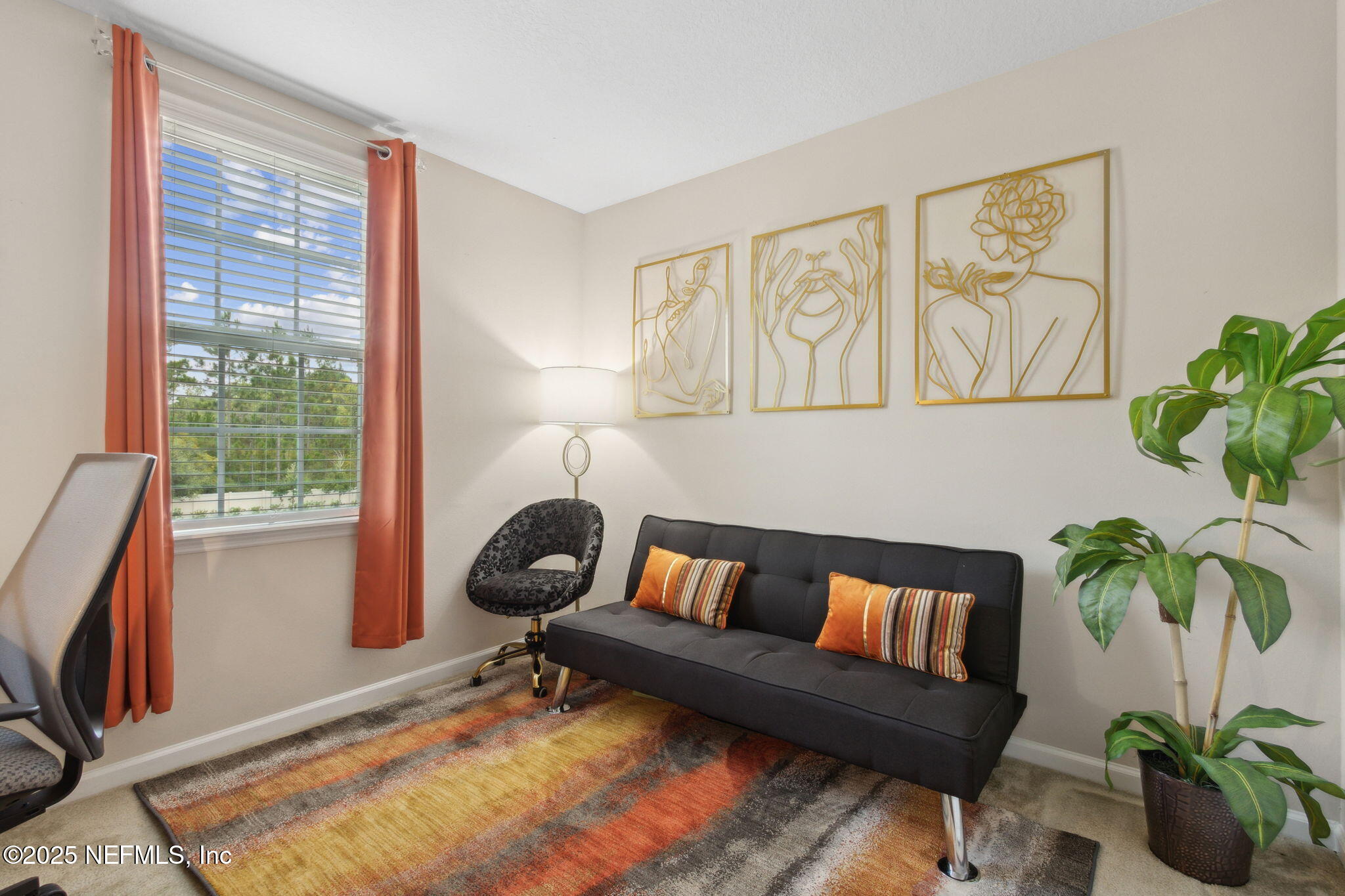 7940 Merchants Way Jacksonville, FL 32222 - Photo 29 of 51 a living room with furniture potted plant and a window