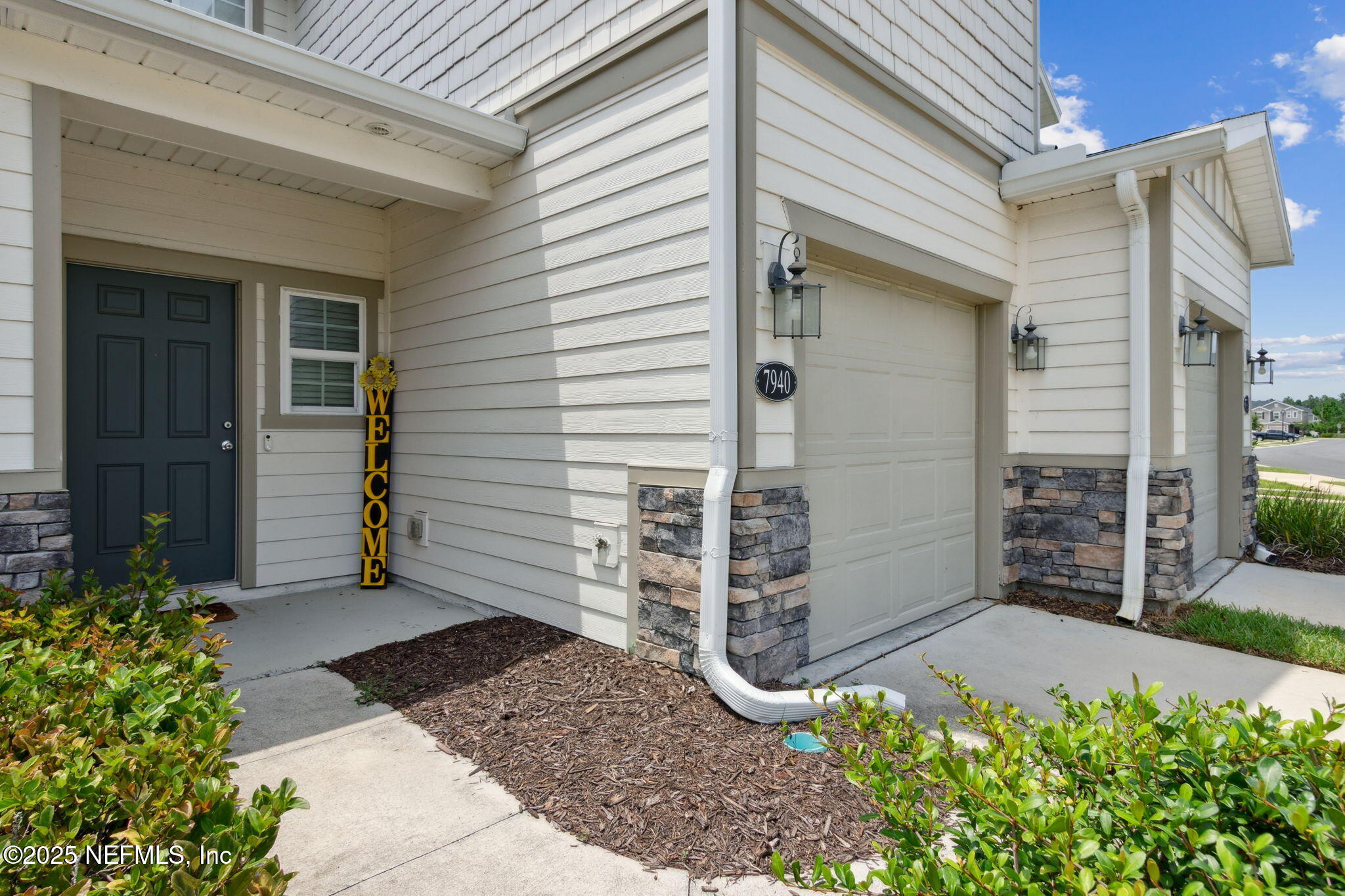 7940 Merchants Way Jacksonville, FL 32222 - Photo 6 of 51 a view of a wooden door of the house