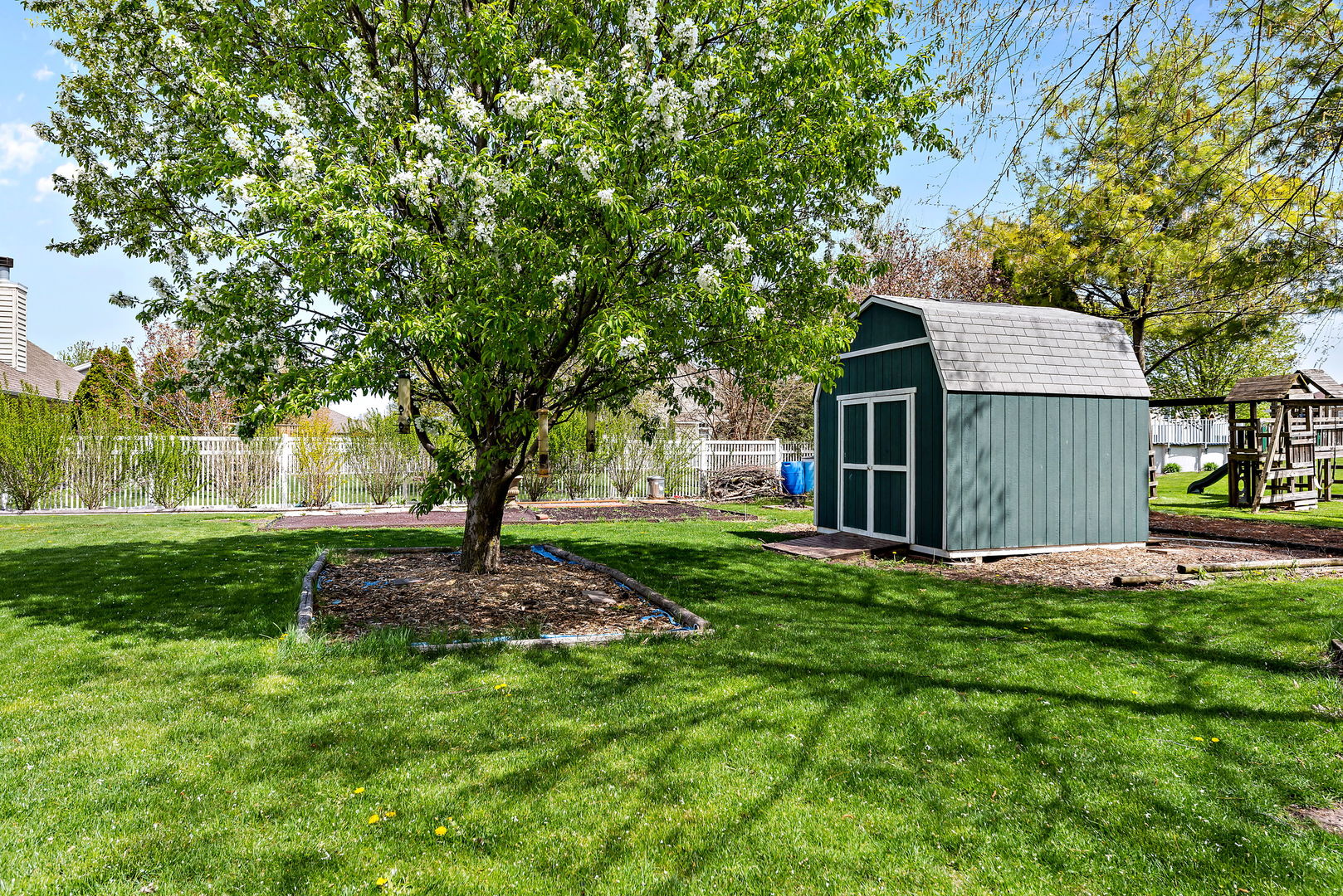 372 Jefferson Street Manteno, IL 60950 - Photo 21 of 24 a view of a house with a yard and tree
