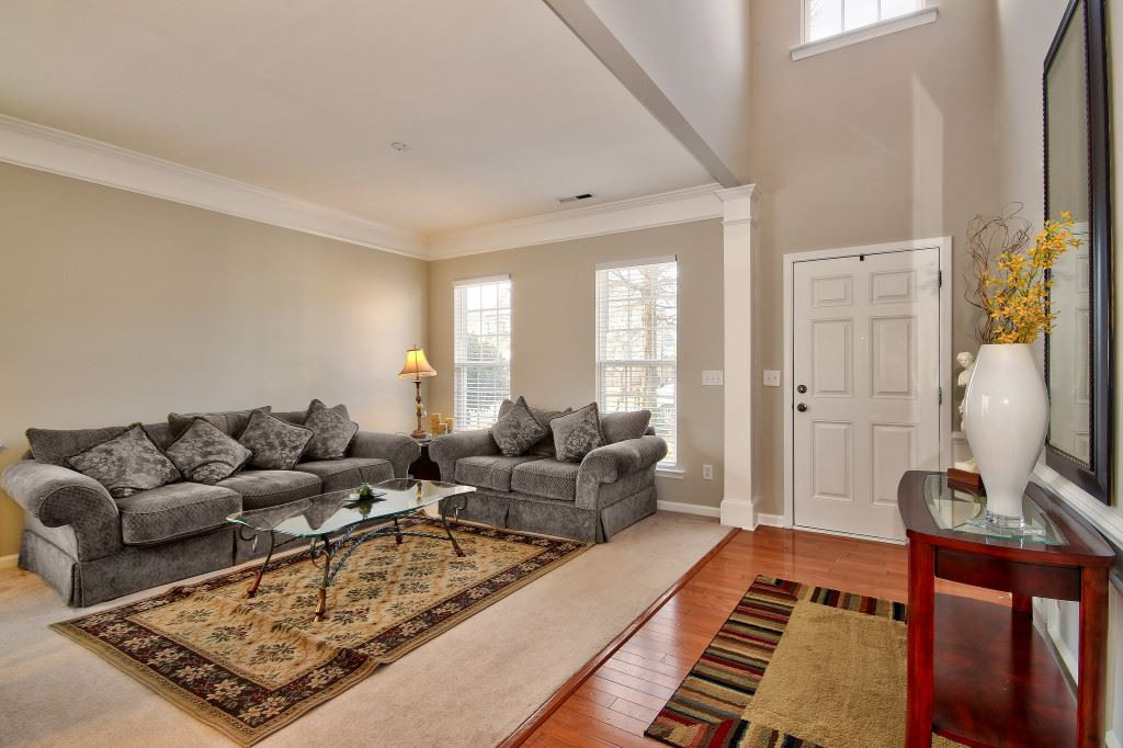 7754 San Gabriel Street Raleigh, NC 27613 - Photo 5 of 25 Large space features lots of windows to allow the natural light to come in, high ceilings and there is a 1/2 bath on the main level for guests. Living Room