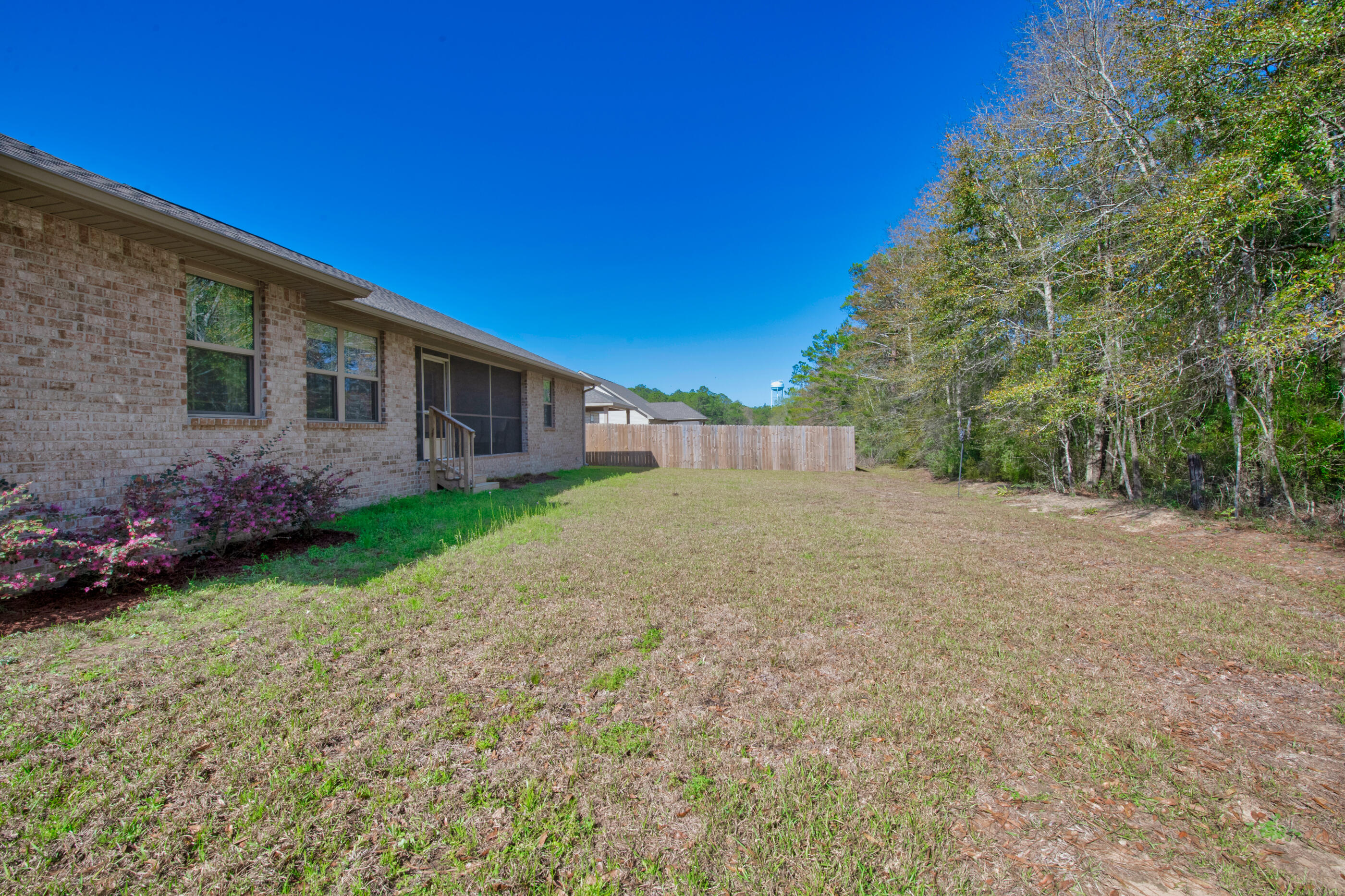 6042 Hidden Valley Road Crestview, FL 32539 - Photo 29 of 34 a view of a house with a yard
