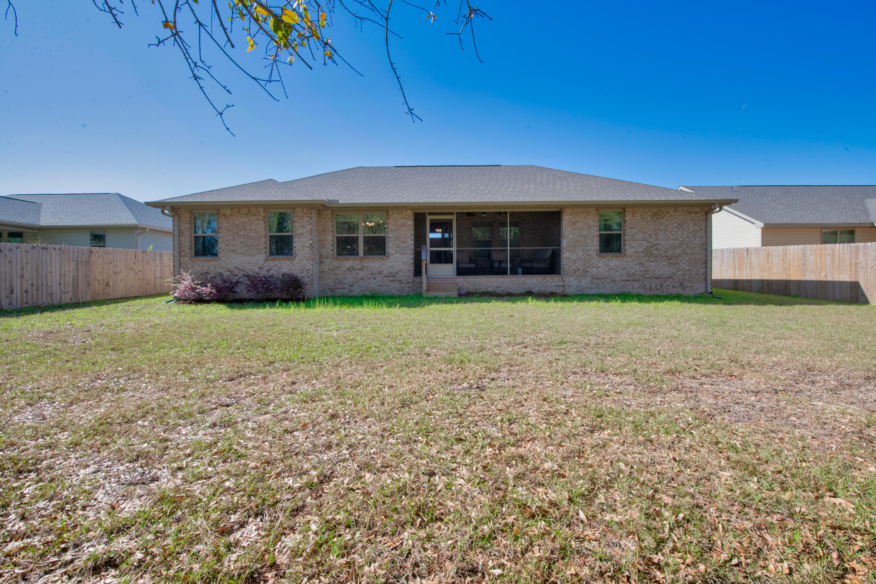 6042 Hidden Valley Road Crestview, FL 32539 - Photo 31 of 34 a view of a house with a yard