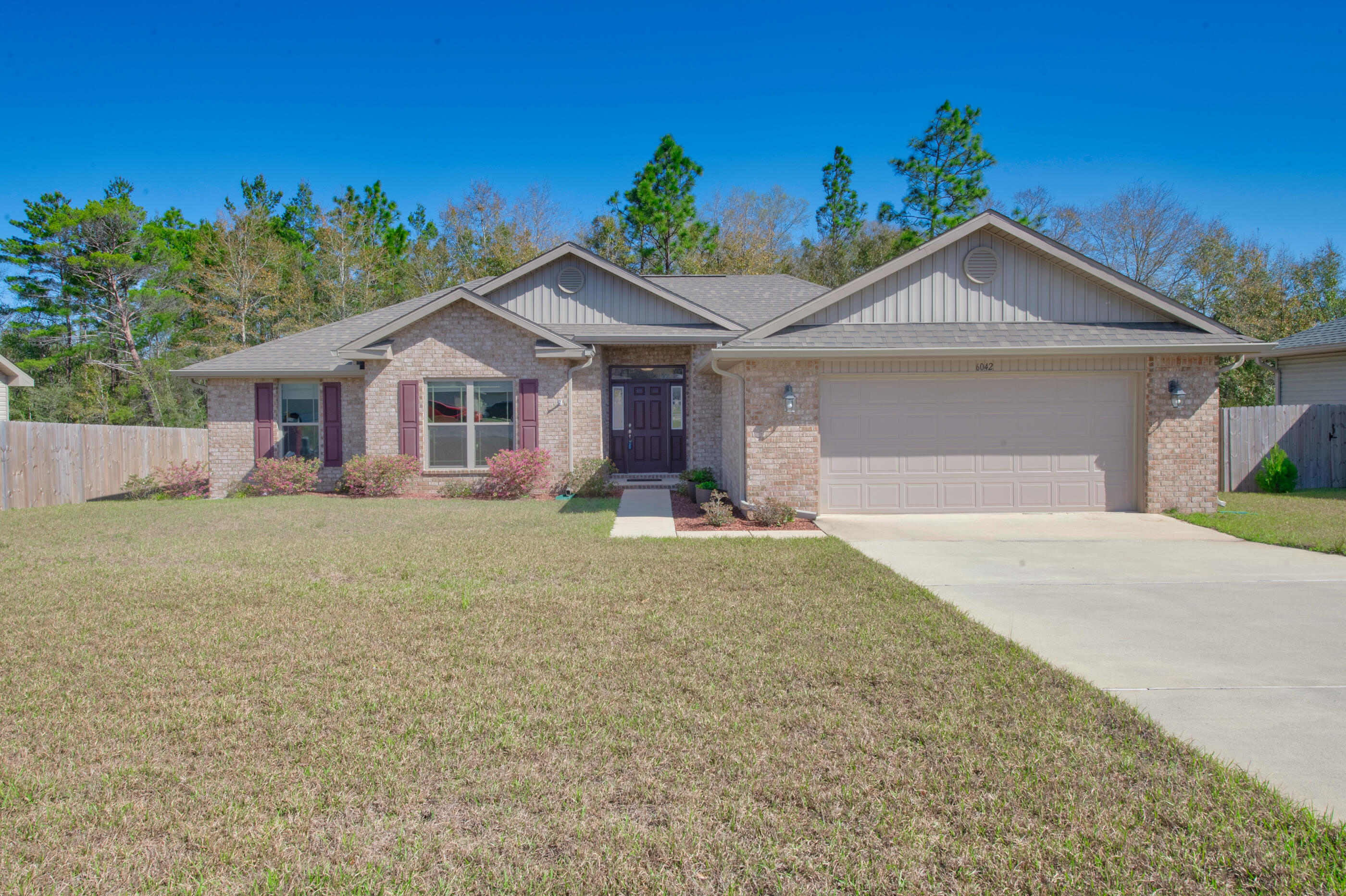 6042 Hidden Valley Road Crestview, FL 32539 - Photo 33 of 34 front view of a house with a yard