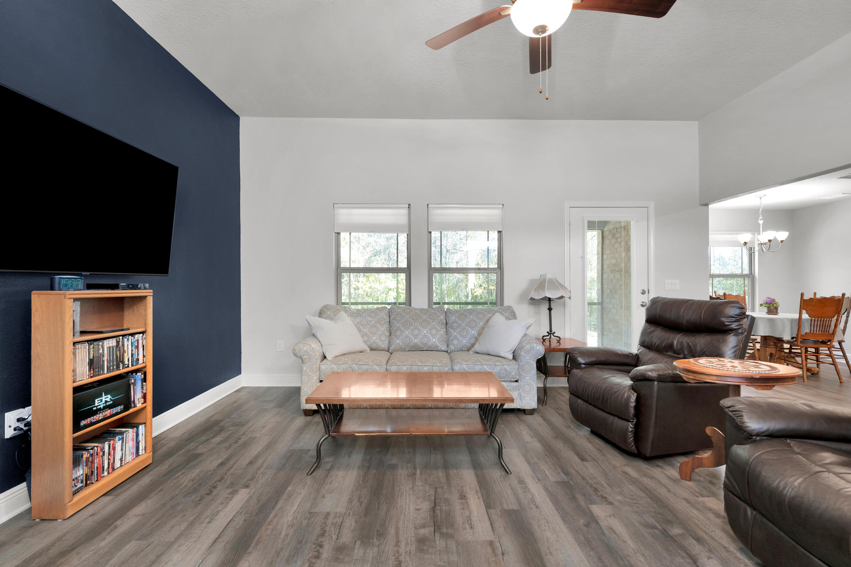 6042 Hidden Valley Road Crestview, FL 32539 - Photo 5 of 34 a living room with furniture and a flat screen tv