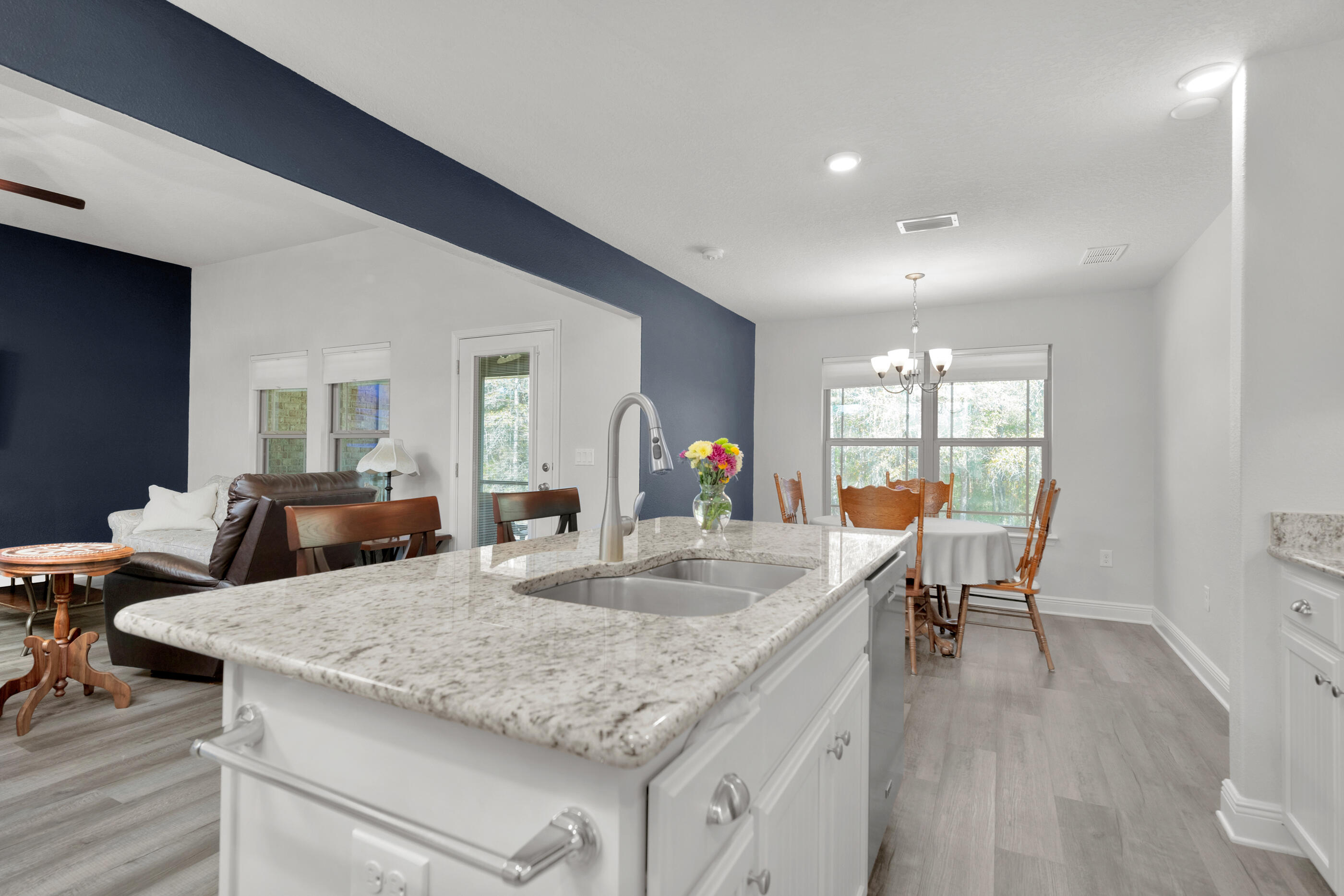 6042 Hidden Valley Road Crestview, FL 32539 - Photo 8 of 34 a kitchen with counter space dining table and chairs