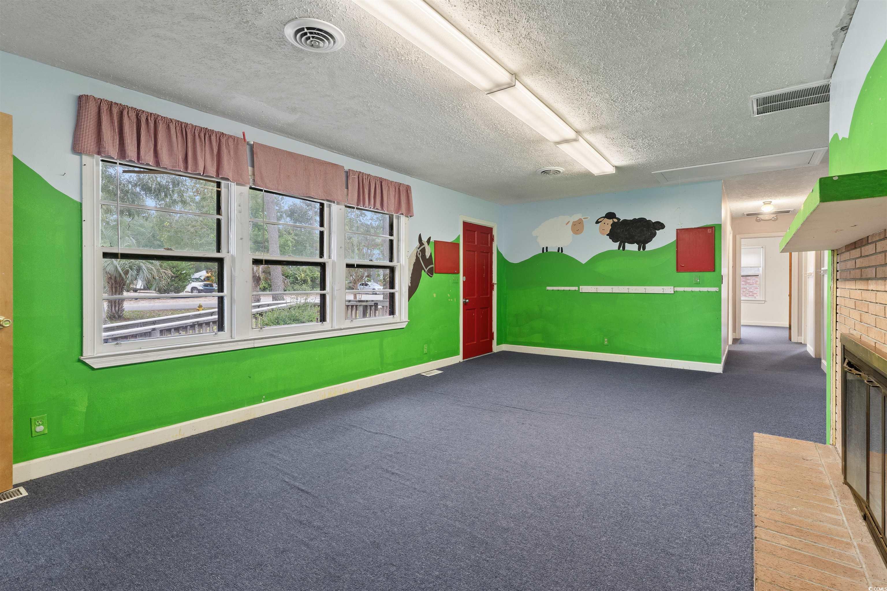 815 Bellamy Road North Myrtle Beach, SC 29582 - Photo 5 of 24 Interior space featuring a textured ceiling, light
