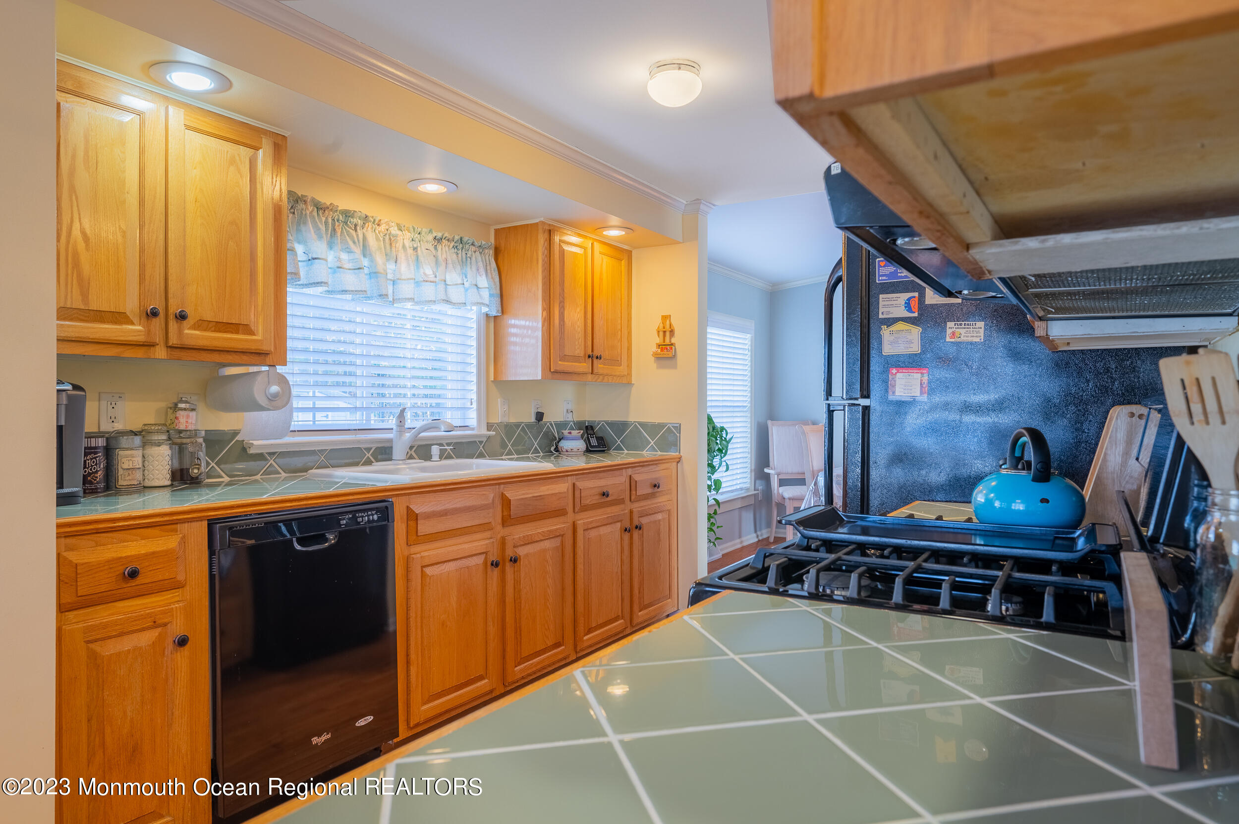 1410 Forest Way Whiting, NJ 08759 - Photo 21 of 34 a room with stainless steel appliances kitchen island granite countertop a sink and cabinets