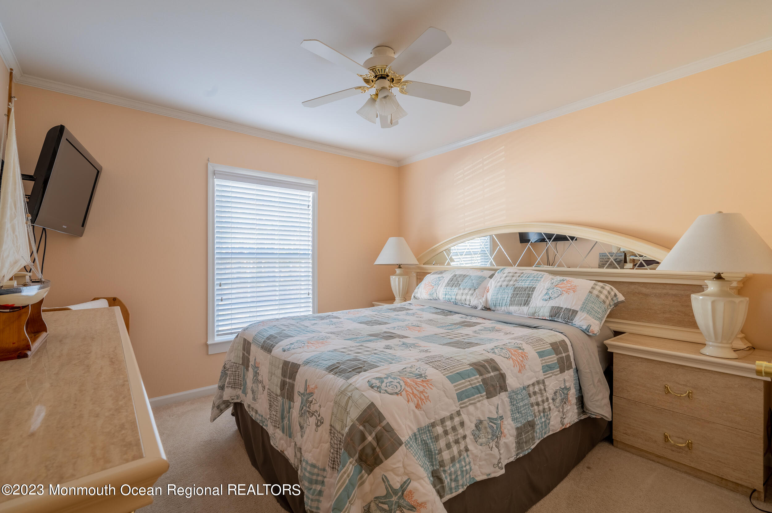 1410 Forest Way Whiting, NJ 08759 - Photo 30 of 34 a bedroom with a bed and a ceiling fan
