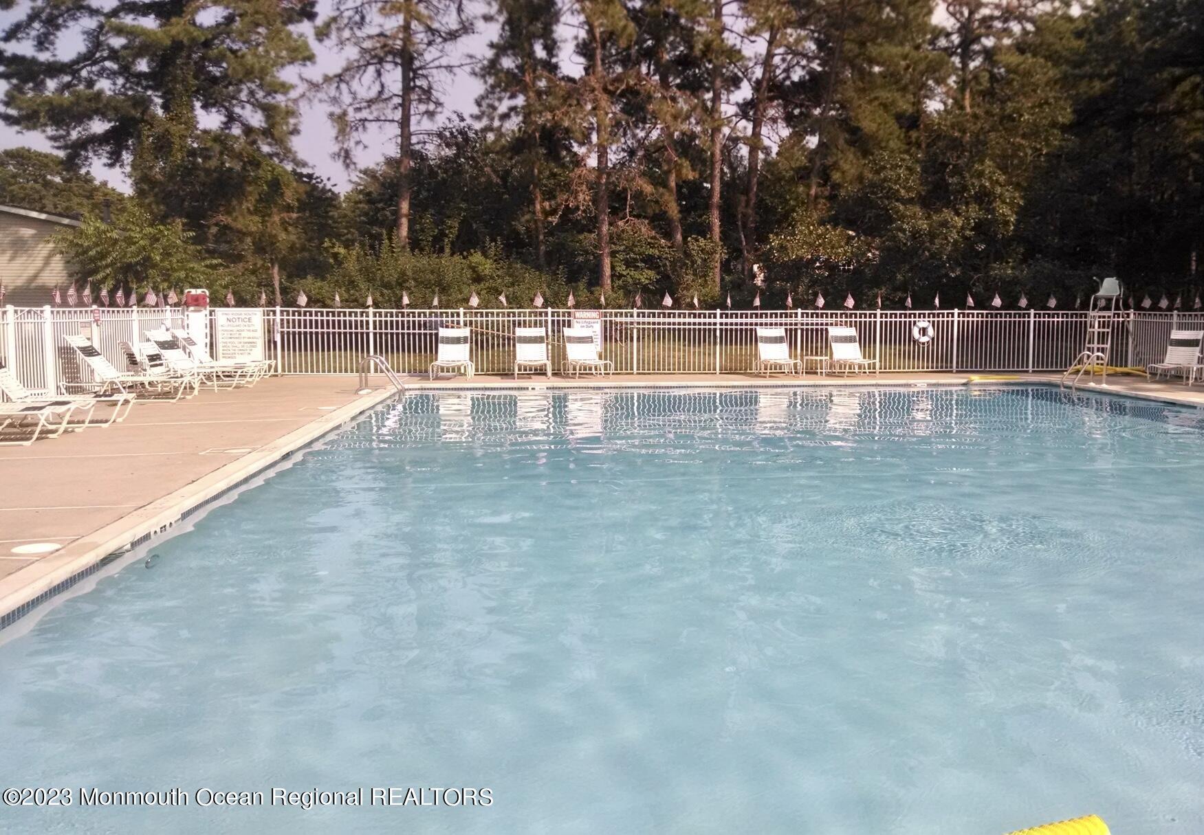 1410 Forest Way Whiting, NJ 08759 - Photo 34 of 34 a view of a swimming pool with an outdoor seating