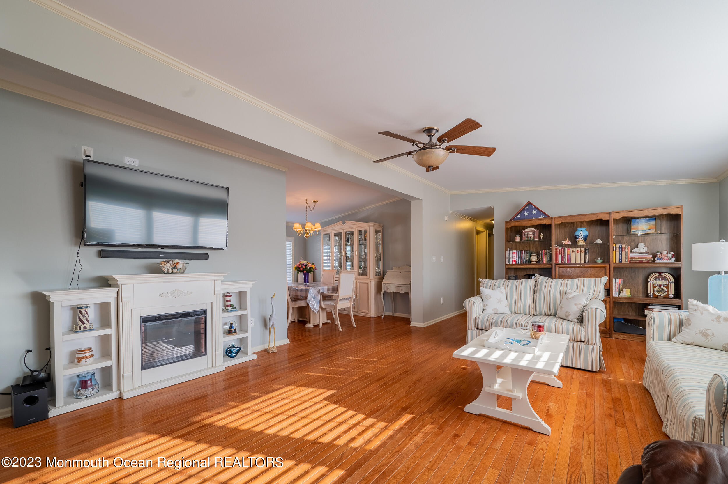 1410 Forest Way Whiting, NJ 08759 - Photo 9 of 34 a living room with furniture a flat screen tv and a fireplace