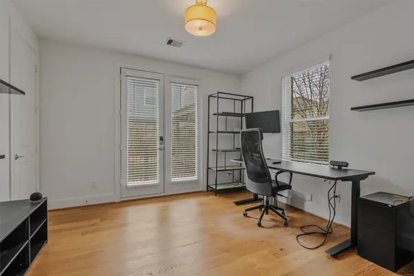 a view of a livingroom with furniture and a window