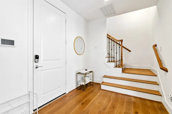 a view of entryway with wooden floor