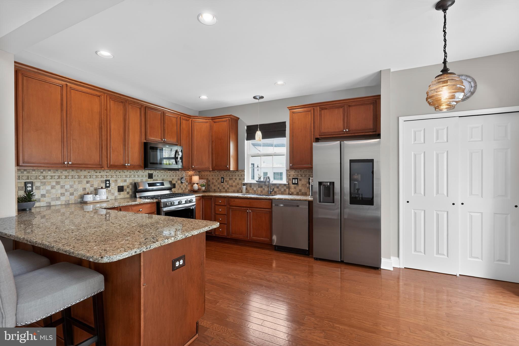 17 Welsford Way Westampton, NJ 08060 - Photo 19 of 41 a kitchen with granite countertop stainless steel appliances and wooden cabinets