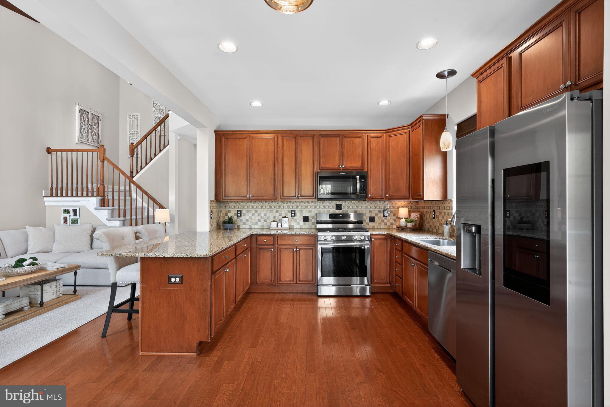 17 Welsford Way Westampton, NJ 08060 - Photo 21 of 41 a kitchen with stainless steel appliances granite countertop a stove refrigerator sink and cabinets