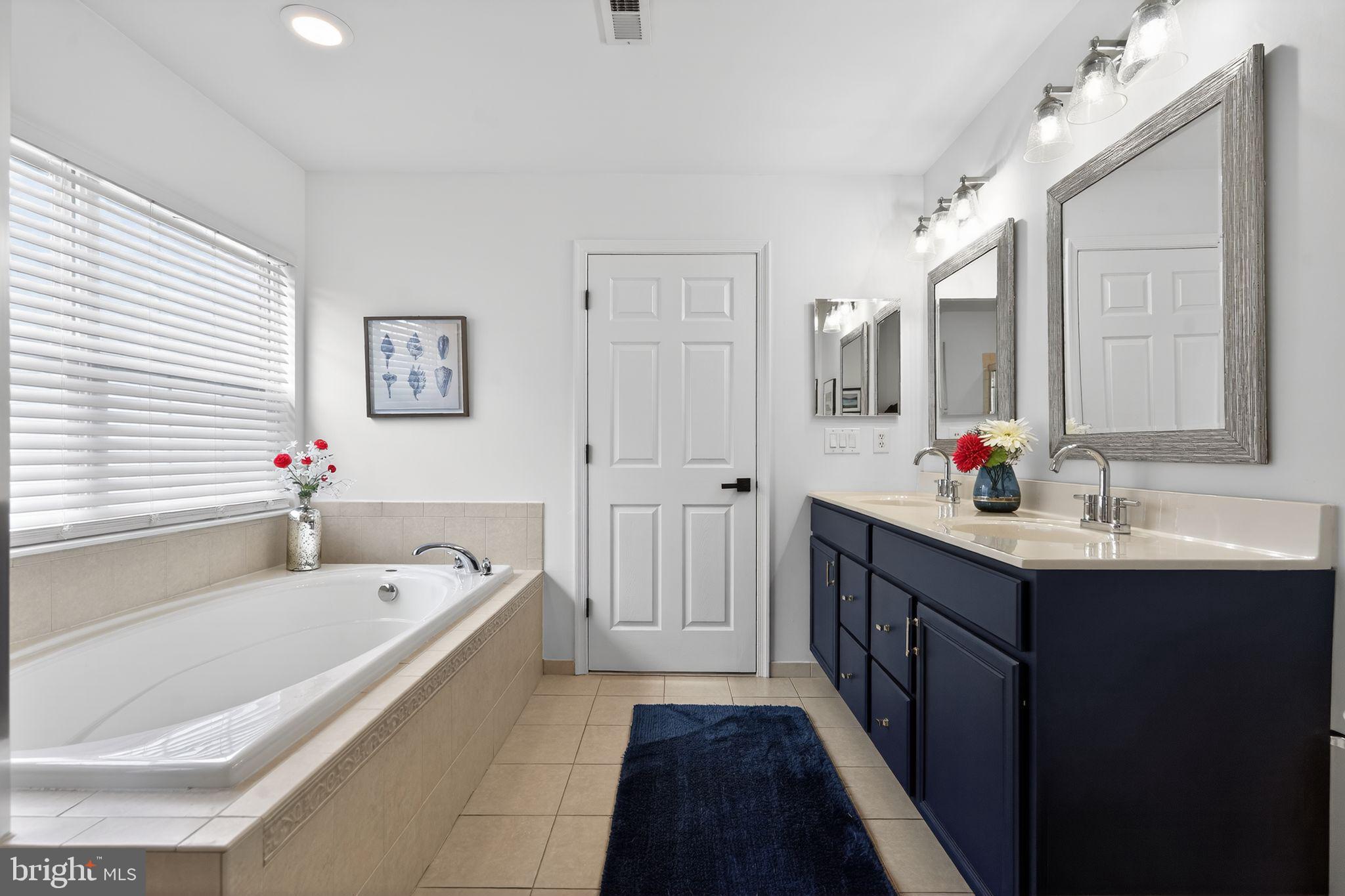 17 Welsford Way Westampton, NJ 08060 - Photo 29 of 41 a spacious bathroom with a tub sink double vanity and mirror