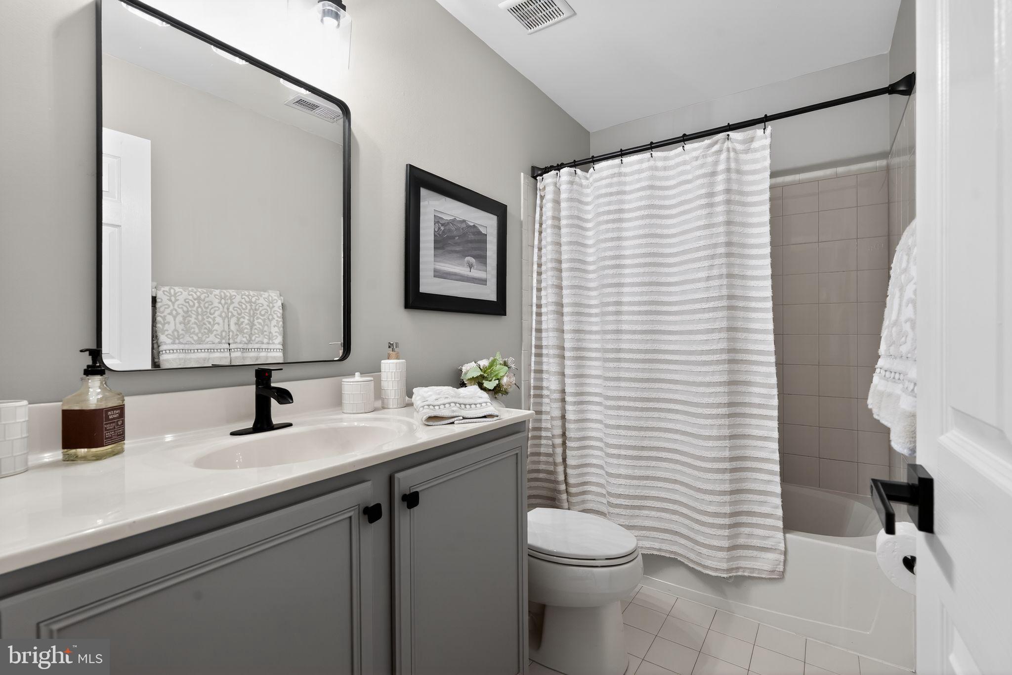 17 Welsford Way Westampton, NJ 08060 - Photo 34 of 41 a bathroom with a sink a toilet and mirror