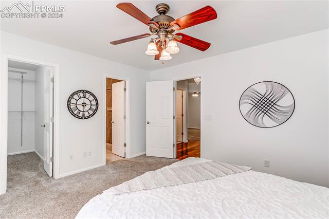 7534 Old Spec Road Peyton, CO 80831 - Photo 23 of 45 Primary bedroom with walk in closet and en-suite