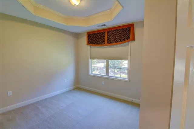 a view of an empty room with windows