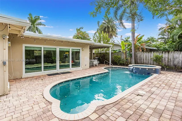 a view of a swimming pool with a patio